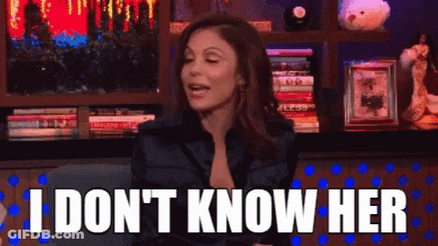 Woman Sitting In Front Of Bookshelf Saying I Don't Know Her GIF