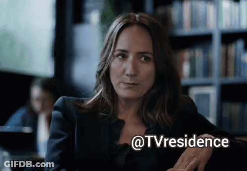 Woman Sitting In Front Of Bookshelf @Tvresidence GIF