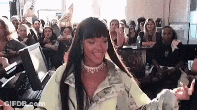 Woman Sitting In Front Of Crowd GIF