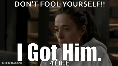 Woman Sitting In Front Of Don't Fool Yourself Sign GIF