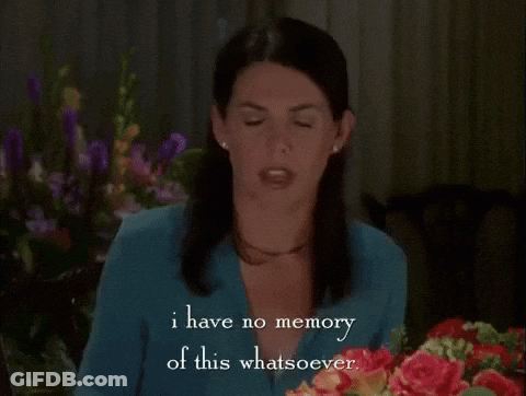 Woman Sitting In Front Of Flowers Says I Have No Memory Of This GIF