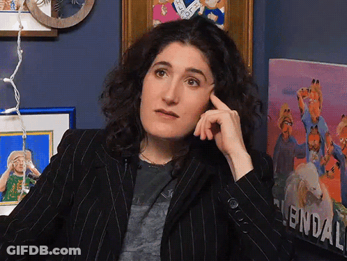 Woman Sitting In Front Of Garfield Painting GIF