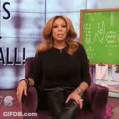 Woman Sitting In Front Of Green Board Saying All GIF