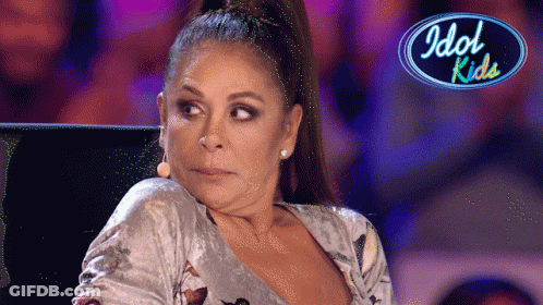 Woman Sitting In Front Of Idol Kids Logo GIF