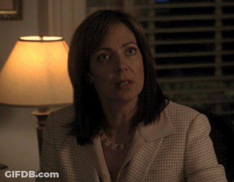 Woman Sitting In Front Of Lamp Looking At Something GIF