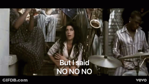 Woman Sitting In Front Of Man Playing Drums Saying But I Said No No No GIF