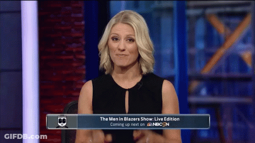 Woman Sitting In Front Of Men In Blazers Sign GIF