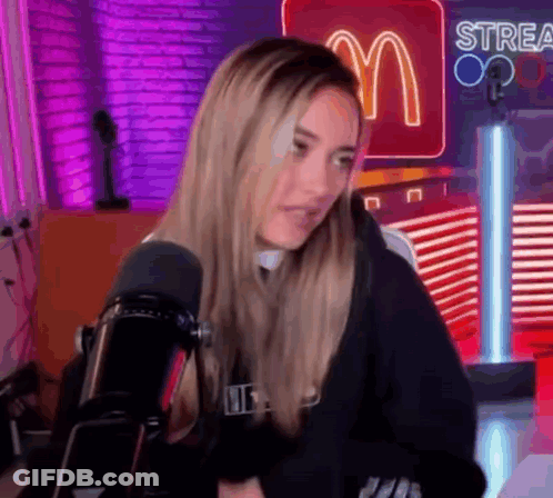 Woman Sitting In Front Of Microphone GIF