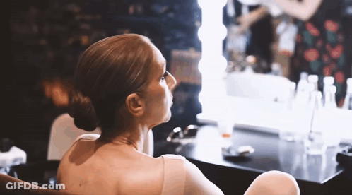 Woman Sitting In Front Of Mirror GIF