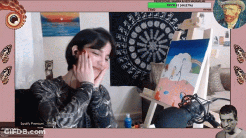 Woman Sitting In Front Of Painting With Spotify Premium Logo GIF