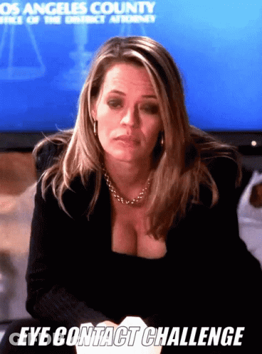 Woman Sitting In Front Of Screen Saying Los Angeles County Office Of The District Attorney GIF