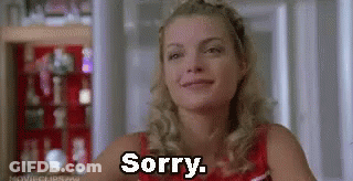 Woman Sitting In Front Of Shelf Saying Sorry GIF