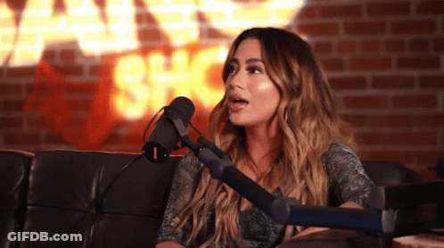 Woman Sitting In Front Of Shock Wall GIF