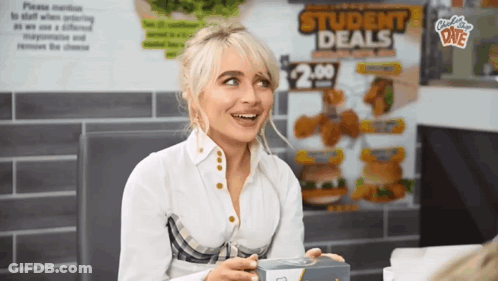 Woman Sitting In Front Of Student Deals Sign GIF