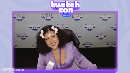 Woman Sitting In Front Of Twitch Con Background GIF