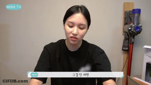 Woman Sitting In Front Of Vacuum Cleaner GIF