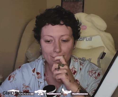 Woman Sitting In Front Of Vanillamacee Logo GIF