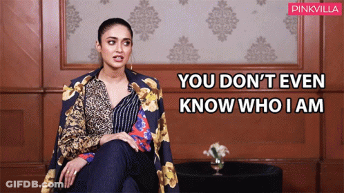 Woman Sitting In Front Of Wall You Don't Even Know Who I Am GIF