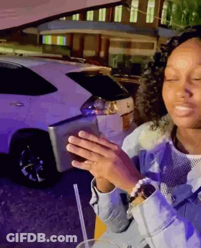 Woman Sitting In Front Of White Car With Straw GIF