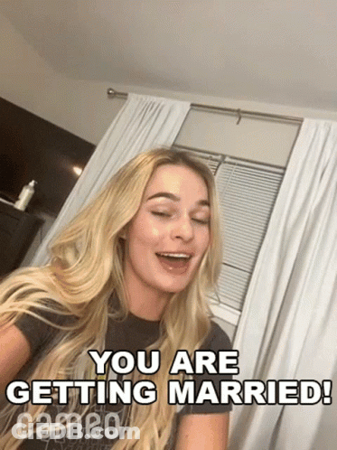 Woman Sitting In Front Of Window Saying You Are Getting Married GIF