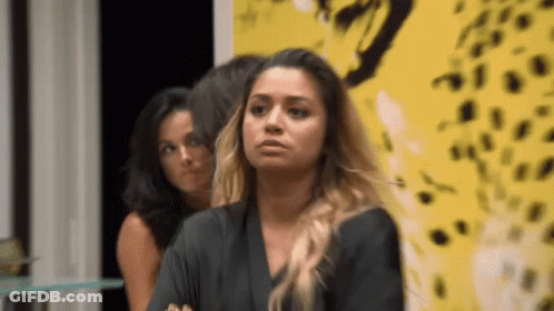 Woman Sitting In Front Of Yellow Leopard Wall GIF