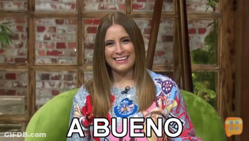Woman Sitting In Green Chair Smiling A Bueno GIF