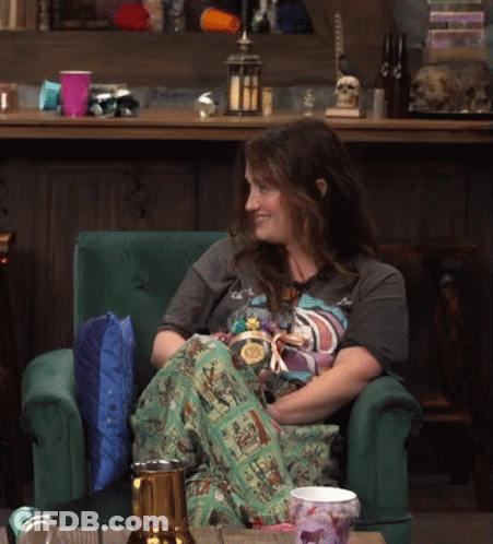 Woman Sitting In Green Chair With Beer GIF