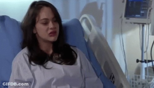 Woman Sitting In Hospital Bed With Monitor On Chest GIF