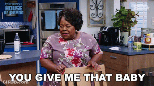 Woman Sitting In Kitchen Saying You Give Me That Baby GIF