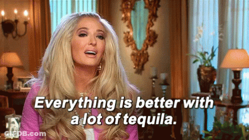 Woman Sitting In Living Room With Tequila GIF