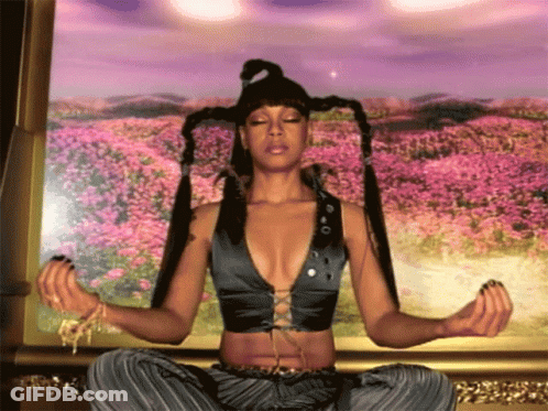 Woman Sitting In Lotus Position With Eyes Closed GIF