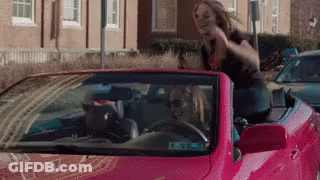 Woman Sitting In Pink Convertible With Head Out Window GIF
