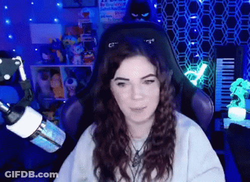Woman Sitting In Purple Chair With G GIF