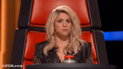 Woman Sitting In Red Chair Holding Button GIF