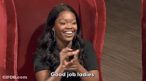 Woman Sitting In Red Chair Smiling GIF