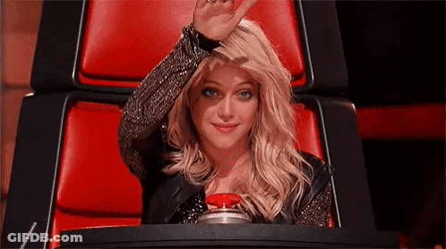 Woman Sitting In Red Chair Waving GIF