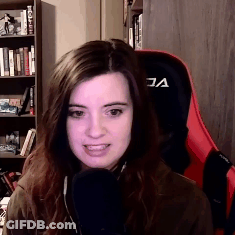 Woman Sitting In Red Chair With A GIF