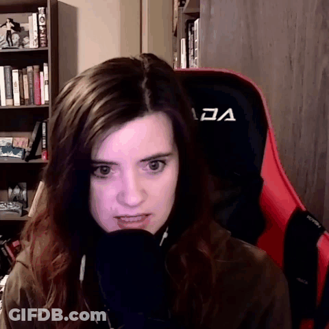 Woman Sitting In Red Chair With A GIF