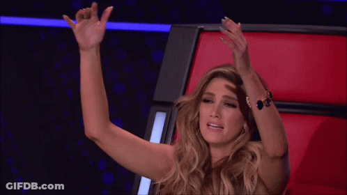 Woman Sitting In Red Chair With Hand On Head GIF