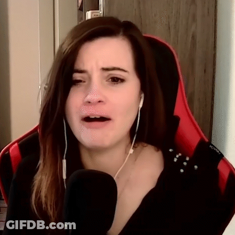 Woman Sitting In Red Chair With Microphone And Headphones GIF