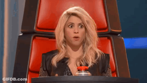 Woman Sitting In Red Chair With Red Button GIF