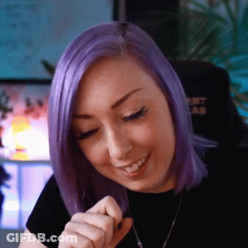 Woman Sitting In Stadium Wearing Apollo Shirt GIF