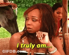 Woman Sitting In Wicker Chair Says I Truly Am GIF