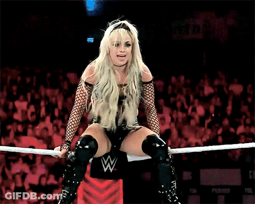 Woman Sitting In Wrestling Ring With W Logo GIF