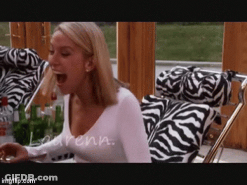 Woman Sitting In Zebra Print Chair GIF