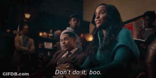 Woman Sitting Next To Man In Suit And Tie GIF
