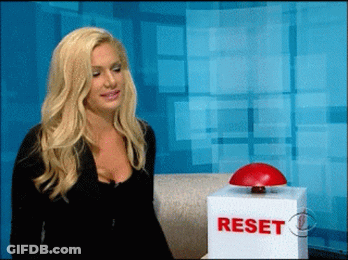 Woman Sitting Next To Reset Box GIF