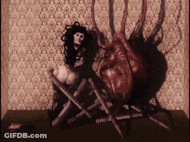 Woman Sitting Next To Spider GIF