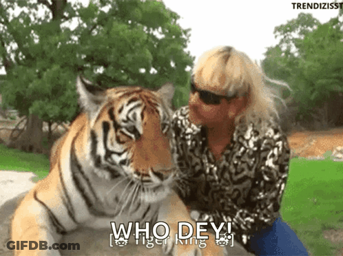Woman Sitting Next To Tiger Saying Who Dey Tiger King GIF