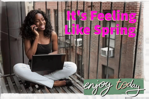 Woman Sitting On Balcony Using Laptop And Phone GIF